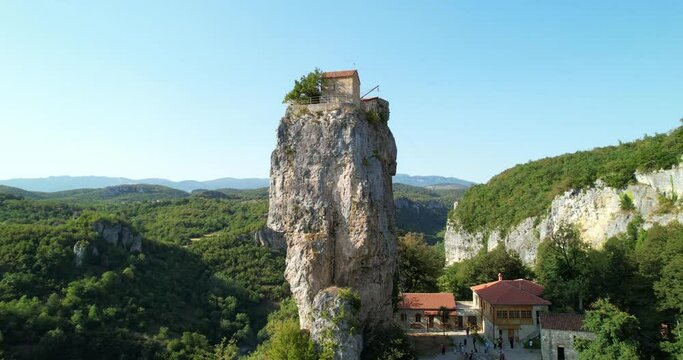 A monastery on top of a cliff. The pillar of Katskhi in Georgia. The Spaso-Voznesensky Monastery on the top of the pillar. Aerial view.