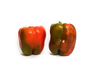 Colorful vegetables, yellow, green and red bell peppers on white background