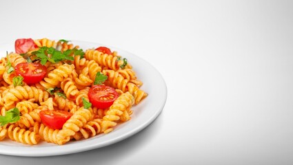Traditional Italian pasta dish with tomatoes in the plate
