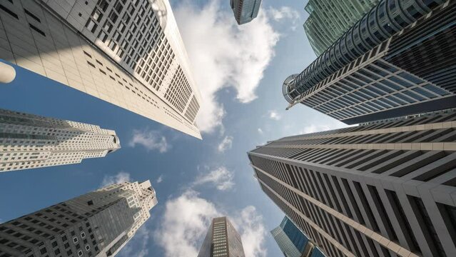 Singapore time lapse 4K, city skyline timelapse looking up under skyscraper building business district