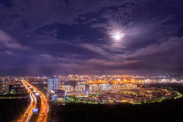 Aerial view of Bitexco Tower, buildings, roads, Thu Thiem 2 bridge and Saigon river in Ho Chi Minh city - Far away is Landmark 81 skyscraper. Travel concept.
