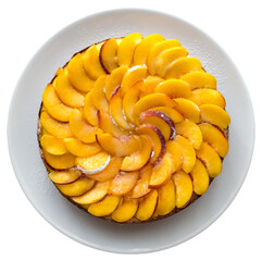 Homemade round juicy sweet peach cake or pie on white plate. Isolated background. Flat lay top view. Sweet food