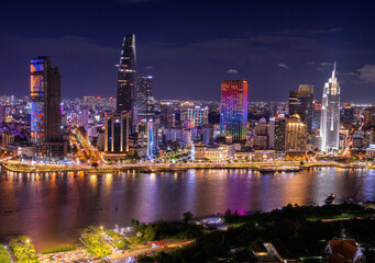 Aerial view of Bitexco Tower, buildings, roads, Thu Thiem 2 bridge and Saigon river in Ho Chi Minh...