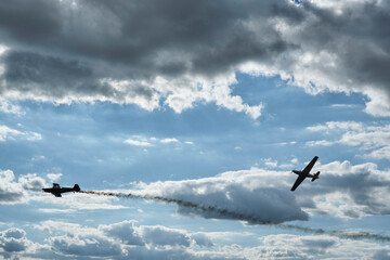 Fighter aircrafts on the sky with clouds