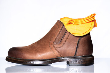 Men's autumn boots made of brown genuine leather isolated on a white background.