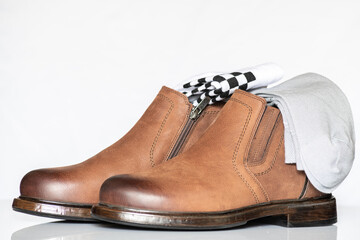 Men's autumn boots made of brown genuine leather isolated on a white background.