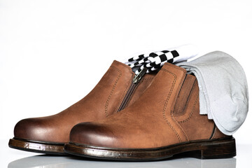 Men's autumn boots made of brown genuine leather isolated on a white background.