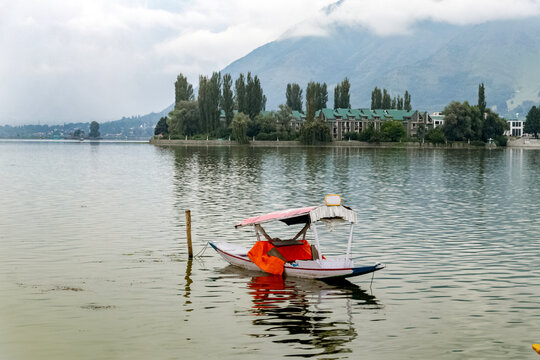 Dal Lake. Srinagar. Jammu Kashmir. shikara in dal lake with beautiful blue sky.