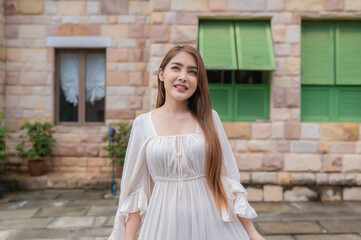 Asian woman traveling at the old town italy style,Alone travel,Lifestyle of single girl,View mountain with fog