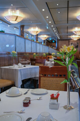 Art Deco interior design style furniture, carpets and paneling onboard classic ocean liner cruiseship cruise ship main dining room restaurant
