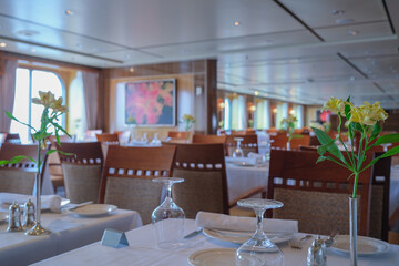 Art Deco interior design style furniture, carpets and paneling onboard classic ocean liner cruiseship cruise ship main dining room restaurant
