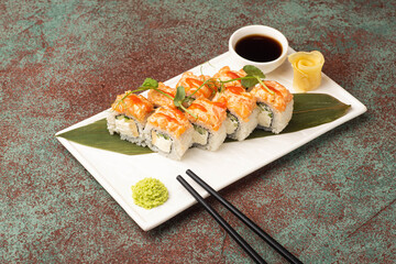 Sushi, rolls, sushi with fish on a textured background, side view