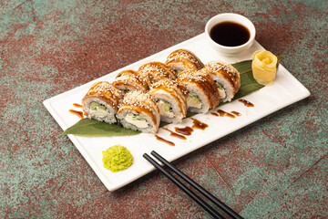 Sushi, rolls, sushi with fish on a textured background, side view