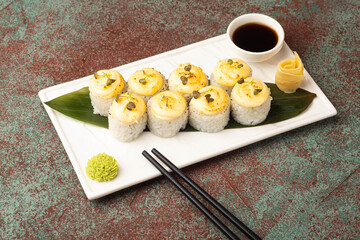 Sushi, rolls, sushi with fish on a textured background, side view