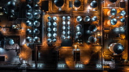 Aerial top view petrochemical tank at night, Oil and gas tank at oil refinery at night,...