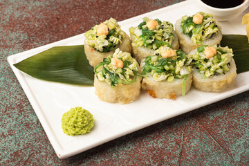 Sushi, rolls, sushi with fish on a textured background, side view