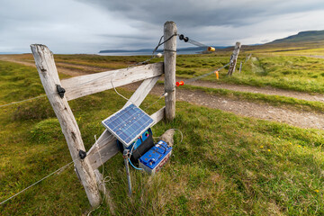 Solar powered electric fence in Iceland fields