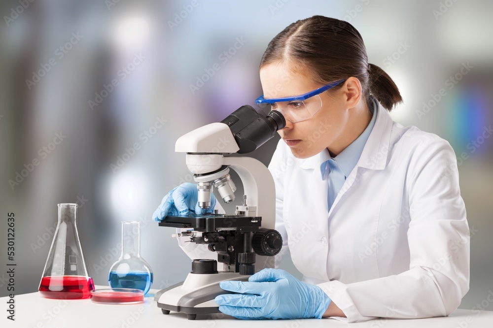 Poster scientists with microscopes doing research and working in laboratory