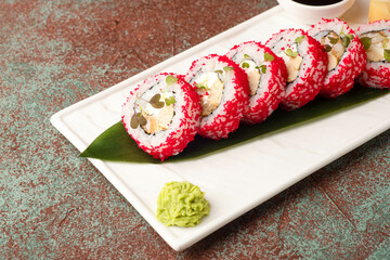 Sushi, rolls, sushi with fish on a textured background, side view