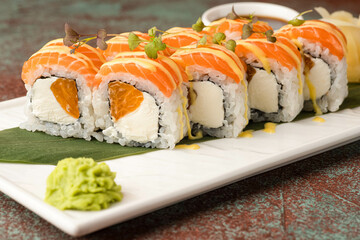 Sushi, rolls, sushi with fish on a textured background, side view