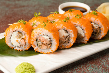 Sushi, rolls, sushi with fish on a textured background, side view