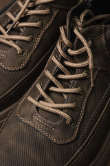 Lacing men's shoes close-up. Autumn men's shoes