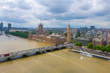 Fototapeta na wymiar Big Ben, the Palace of Westminster and Westminster Bridge over River Thames aerial view in London, England, UK. The Big Ben and Palace is UNESCO World Heritage Site since 1970. 