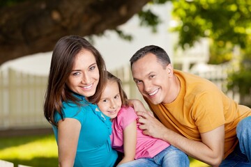 Fototapeta premium Happy family with a child playing on outdoor