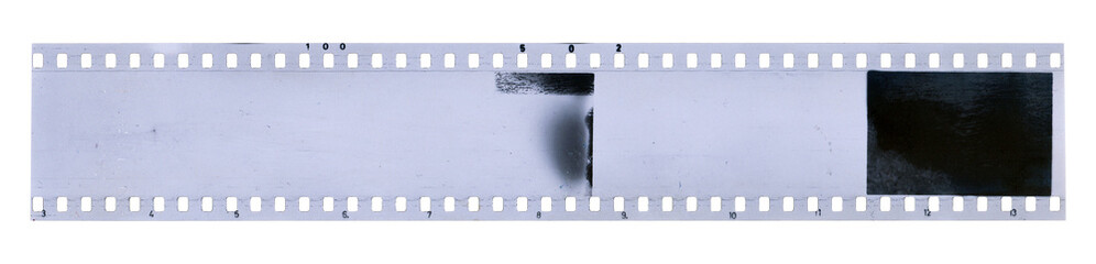 Strip of old celluloid film with dust and scratches on transparent background - 530124802