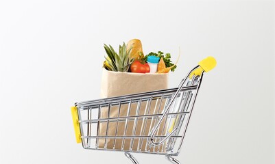 Shopping cart full of groceries and vegetables