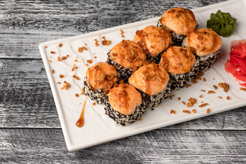 Sushi, rolls, sushi with fish on a white wooden background