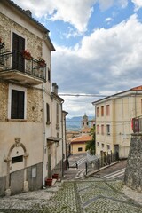 A narrow street between the old stone houses of Caramanico Terme, a medieval village in the Abruzzo region of Italy.