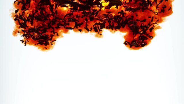 Super slow motion of pouring black tea into water. Isolated on white background. Filmed on high speed cinema camera, 1000fps. Speed ramp effect.