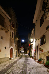 A narrow street between the old stone houses of Caramanico Terme, a medieval village in the Abruzzo region of Italy.