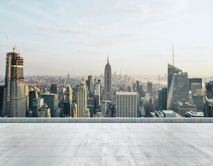 Empty concrete dirty rooftop on the background of a beautiful New York city skyline at daytime,...