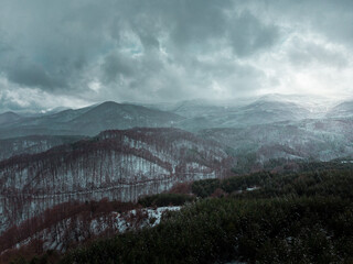 Naklejka premium Beautiful drone landscape scenery of snowy forest and epic sky.