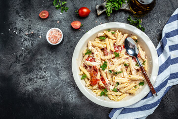 cooking recipe Fetapasta with cherry tomatoes, feta cheese, garlic and thyme on white plate. banner, menu, recipe place for text, top view