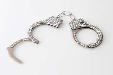 Handcuffs with jewelry, sex toy isolated on white background