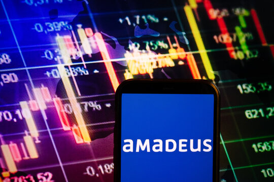 KONSKIE, POLAND - September 10, 2022: Smartphone displaying logo of Amadeus IT Group company on stock exchange chart background