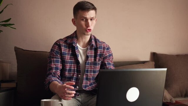 Young man received bad news. laptop work. anger