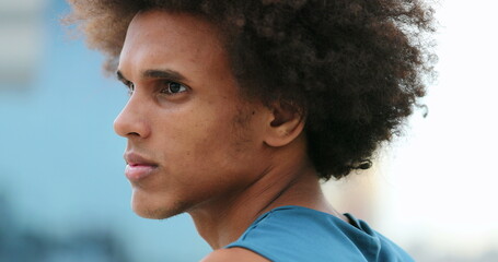 Profile of smart handsome mixed race young man thinking