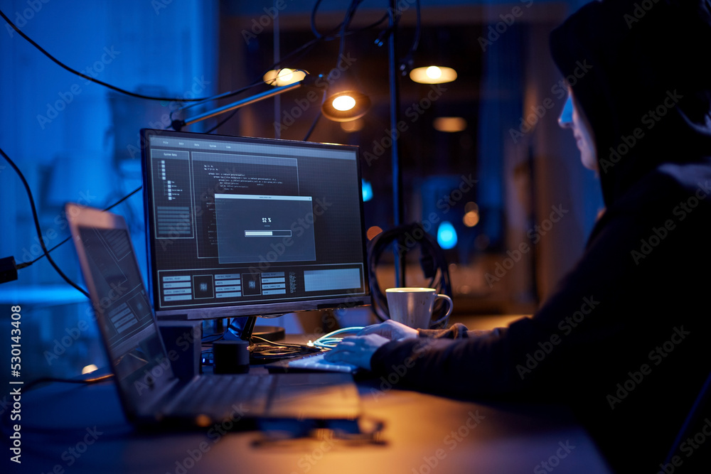 Poster cybercrime, hacking and technology concept - female hacker in dark room writing code or using comput