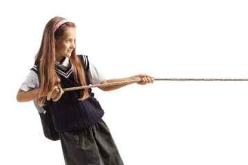 Girl in a school uniform pulling a rope