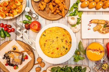 Recipes of typical Spanish dishes and tapas with potato omelette with vegetables, fried padrón peppers, Cordovan salmorejo, Madirleñas bravas potatoes and other delicious things