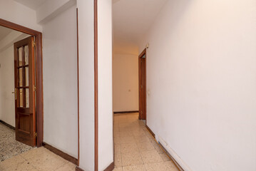 Corridor division in an empty house with old terrazzo floors