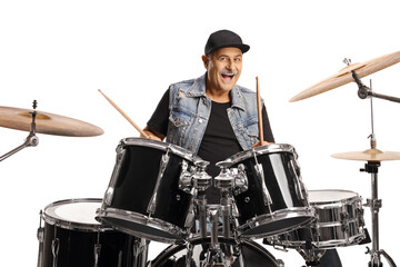 Cheerful mature drummer playing and smiling