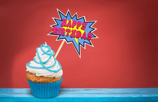Celebration birthday cupcake on color background
