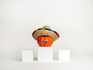 Funny pumpkin with eyes in a hat. Halloween concept. Creative idea.