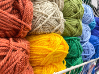 Balls of yarn for knitting. The concept of needlework and knitting. Selective focus