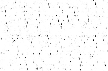 Small uneven spots and particles of debris. Abstract vector texture. Distressed uneven background. Grunge texture overlay with fine grains isolated on white background. Vector illustration. EPS10.